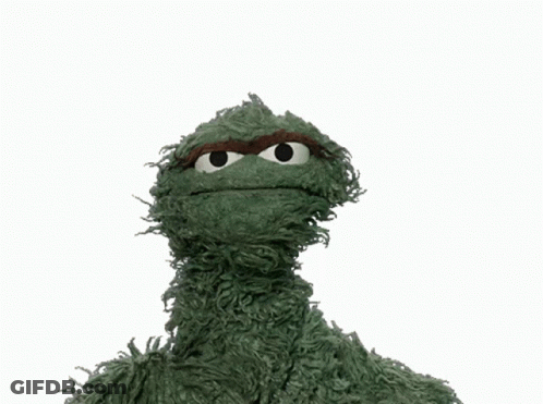 Green Sesame Street Character Holding Scram Sign GIF