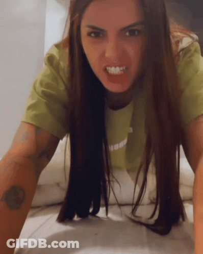 Green Shirt Woman Crawling On Bed Mouth Open GIF