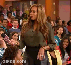 Green Shirt Woman Holds Pink Mic To Crowd GIF