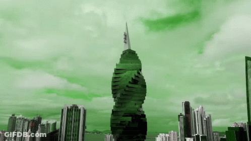 Green Skyscraper In City Skyline GIF