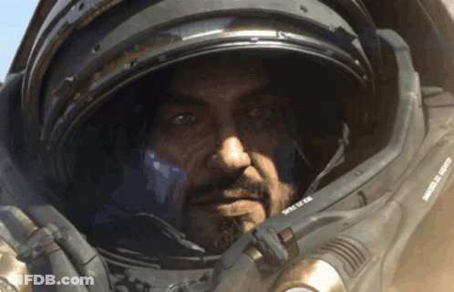 Green Space Ship Flying Above Clouds GIF