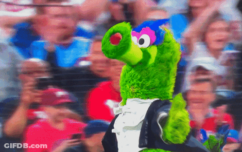 Green Stuffed Animal In Tuxedo And Bow Tie GIF