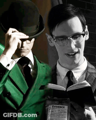 Green Suit Man Reading Book Beside Black And White Photo GIF