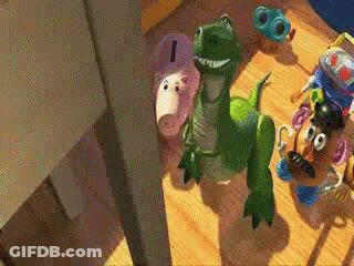 Green Toy Dinosaur Next To Potato Head GIF