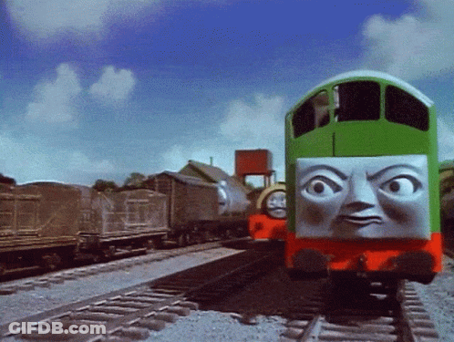 Green Train With Face On Tracks GIF