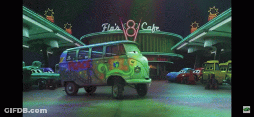 Green Van Parked In Front Of Fla 'S 8 Cafe GIF