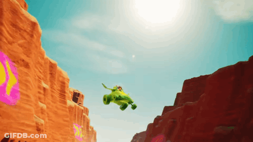 Green Vehicle Flying Over Desert GIF