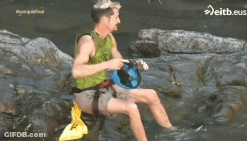 Green Vest Man On Rock In Water Eitb.eus GIF