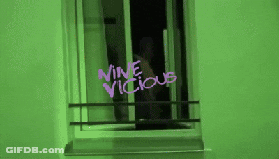 Green Wall With Purple Writing Saying Nine Vicious GIF