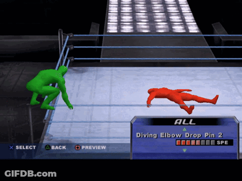 Green Wrestler Vs Red Wrestler In Ring GIF