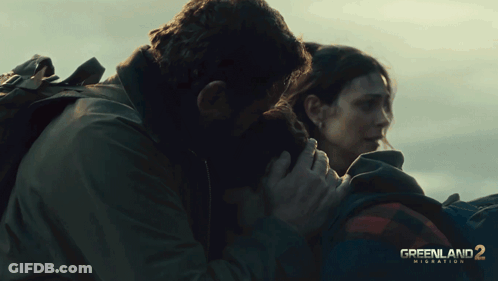 Greenland 2 Migration Movie Poster Man And Woman Hugging GIF