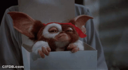 Gremlin Peeking Over Box GIF