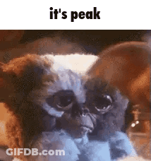 Gremlin Toy With Sharp Claws And Red Eyes GIF