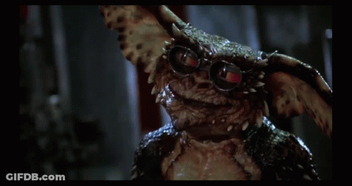 Gremlin Wearing Glasses Looking At Camera GIF