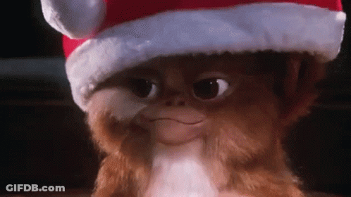 Gremlin Wearing Santa Hat Smiling GIF