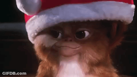 Gremlin Wearing Santa Hat Smiling GIF