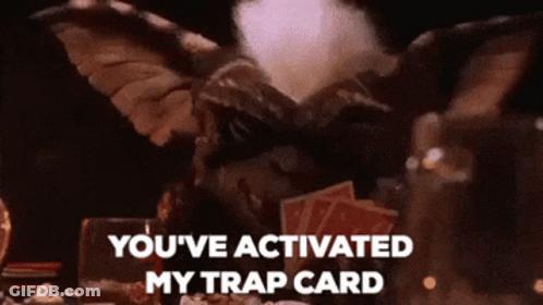 Gremlin With Cards Saying You've Activated My Trap Card GIF