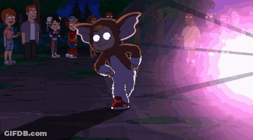 Gremlin With Purple Light Behind Him GIF