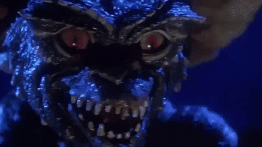 Gremlins Creepy Evil Laugh GIF