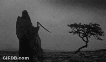Grim Reaper With Scythe In Desert GIF