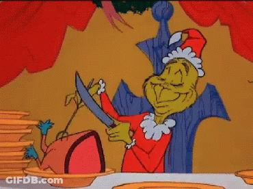 Grinch Cutting Sausage GIF