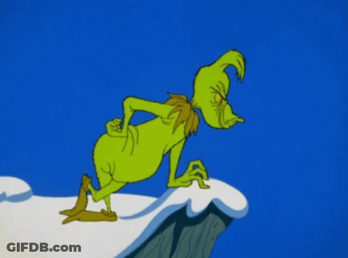 Grinch Standing On Snow Covered Cliff GIF