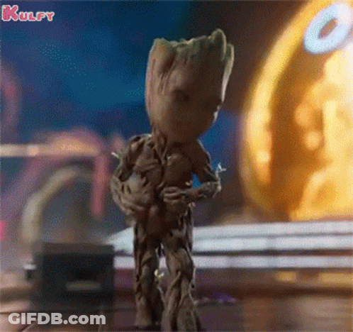 Groot Dancing In Front Of Yellow Object GIF