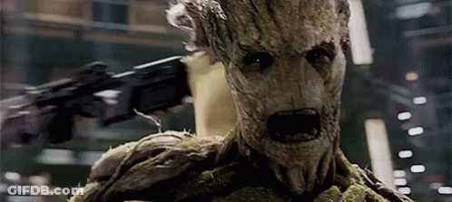 Groot Holding Gun And Looking GIF