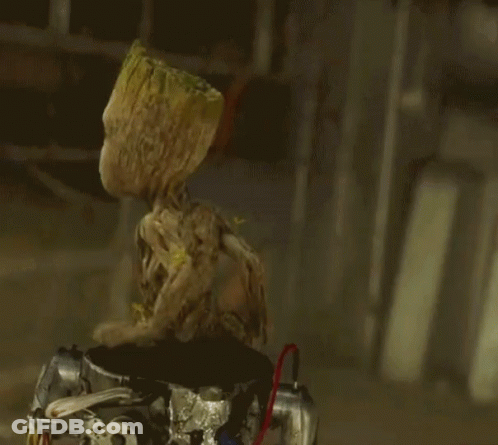 Groot Sitting Down And Waving GIF