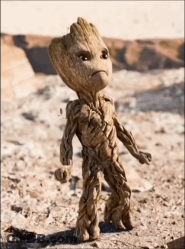 Groot Sitting On Rock Holding Box GIF