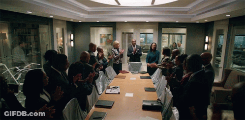 Group Applauding Around Conference Table GIF