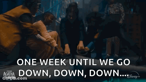 Group Around Coffin Saying One Week Until We Go Down Down Down GIF