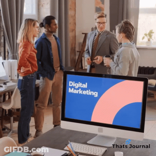 Group Around Computer Monitor Saying Digital Marketing GIF