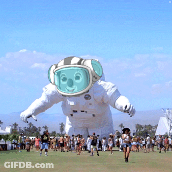 Group Around Giant Inflatable Astronaut Balloon GIF