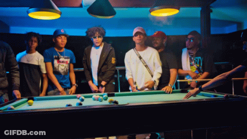 Group Around Pool Table With Man Holding Cue GIF