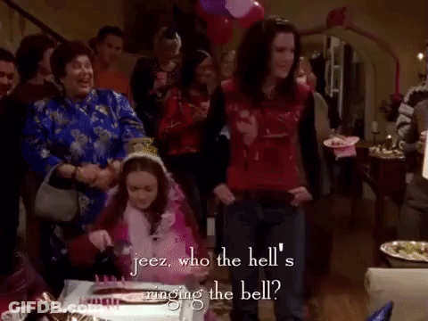 Group Around Table With Cake And Balloons GIF