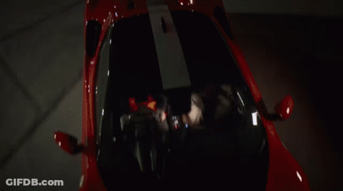 Group Around Table With Jack Daniel's Bottle GIF
