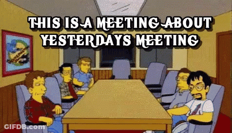 Group Around Table With This Is A Meeting About Yesterday's Meeting GIF
