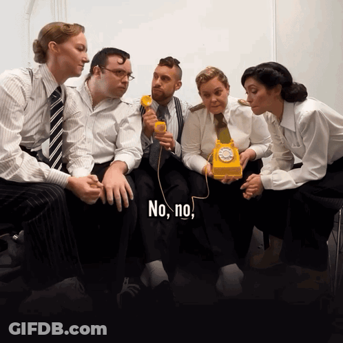 Group Around Yellow Telephone Saying No No GIF
