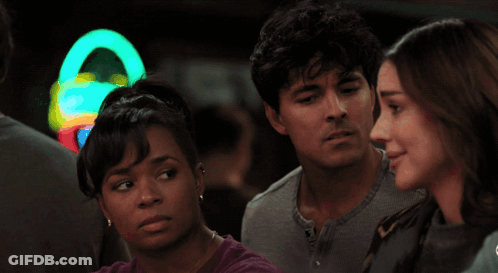 Group At Bar With Seahawk Banner GIF