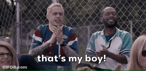 Group At Chain Link Fence Saying That's My Boy GIF
