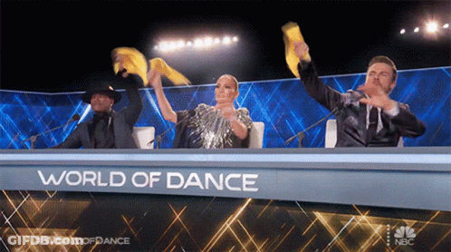Group At World Of Dance Table GIF