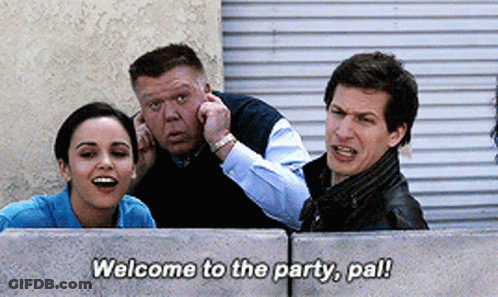 Group Behind Concrete Wall Saying Welcome To The Party Pal GIF