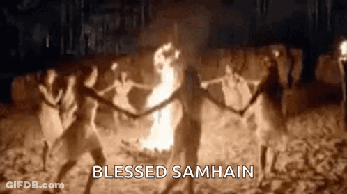 Group Dancing Around Fire In Dark GIF
