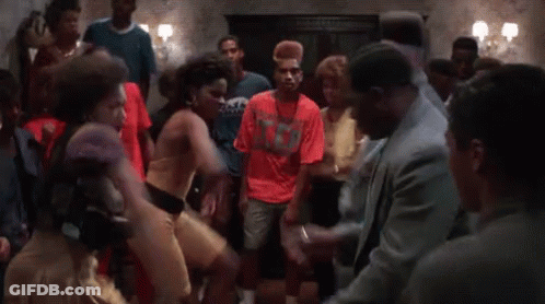 Group Dancing Around Man In Suit GIF