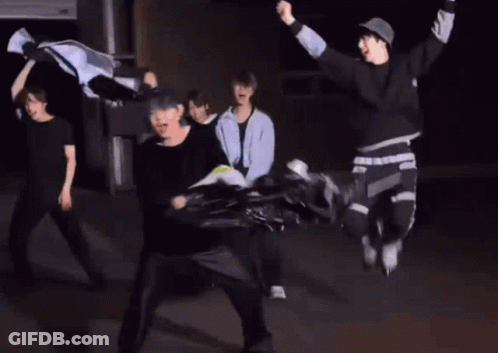 Group Dancing In Dark Room While Man Throws Frisbee GIF