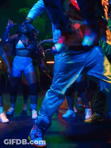 Group Dancing In Dark Room With Blue Light GIF