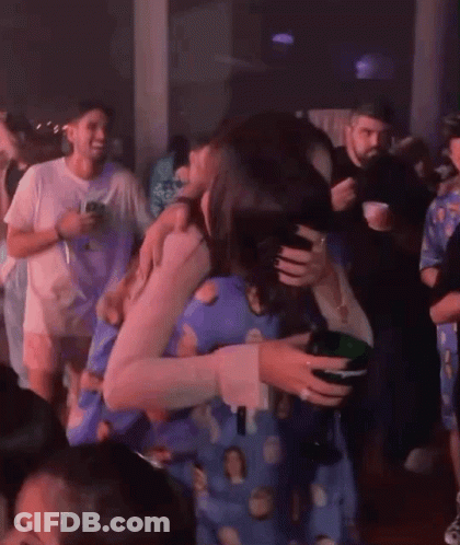 Group Dancing In Dark Room Woman Holding Wine GIF