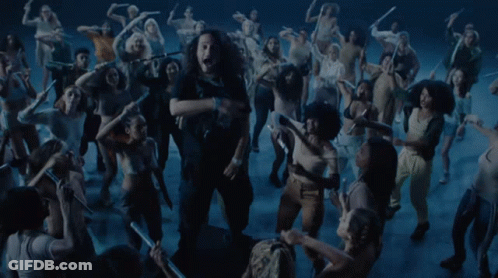Group Dancing In Dark Room Woman Sticking Tongue Out GIF