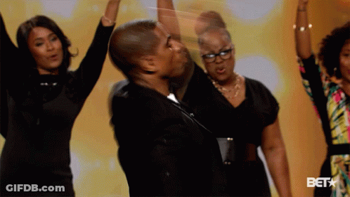 Group Dancing In Front Of Bet Sign GIF
